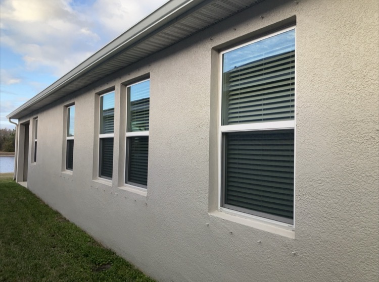 Impact rated window and hurricane shutters documented during wind mitigation inspection